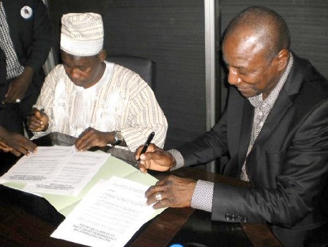 Feature image Papa Koly Kourouma et le Président Alpha Condé