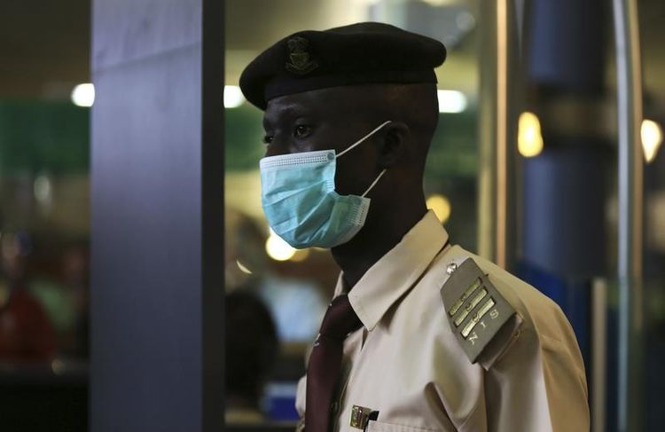672802-immigration-officer-wears-a-face-mask-at-the-nnamdi-azikiwe-international-airport-in-abuja