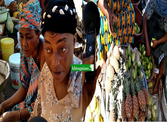 Feature image Mama Adama Bangoura à côté de son étal