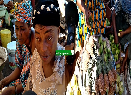 Mama Adama Bangoura  à côté de son étal