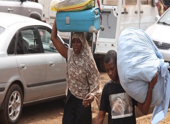 Feature image Des victimes des casses de Kaporo fuient avec leurs bagages