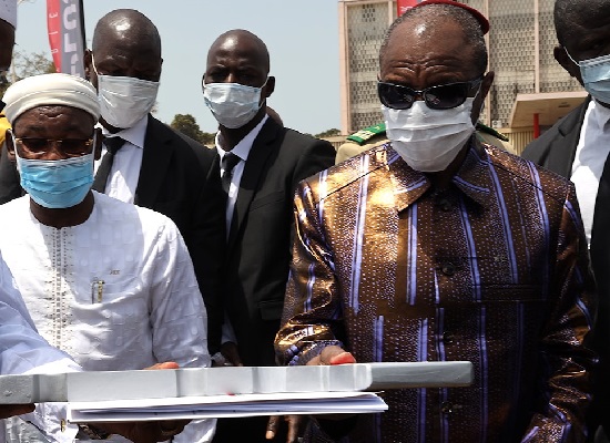 Alpha Condé, président de la République de Guinée et ministre de l'hydraulique et de l'assainissement Papa Koly Kourouma
